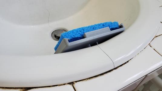 Addaptive sink over flow sponge holder