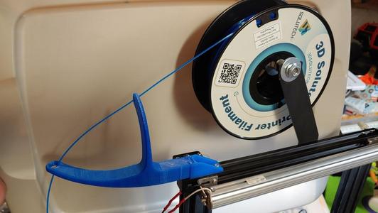 Dual arm filament guide