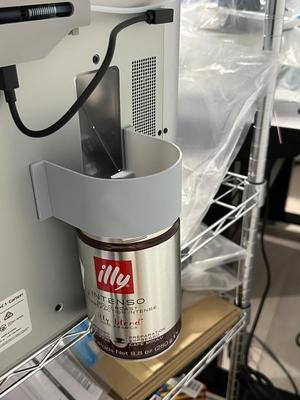 Magnetic illy coffee tin poop chute