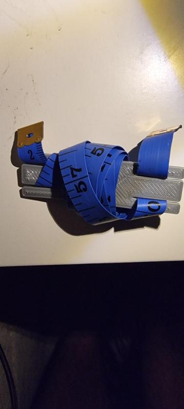 Flexible tape measure holder