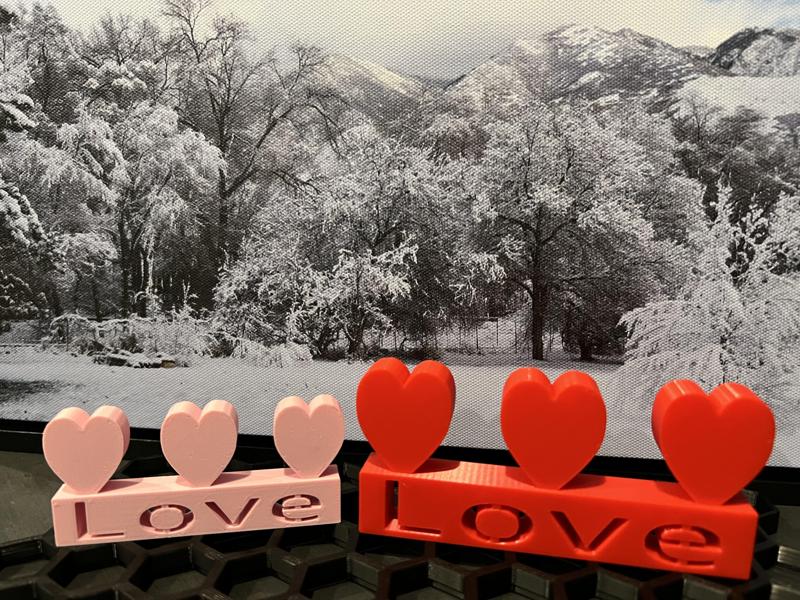 Love plaque with three hearts