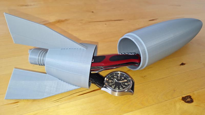 Geschenkverpackung in Form einer Rakete (mit Teelicht-Beleuchtung) / Gift box in the shape of a rocket (with tea light illumination)