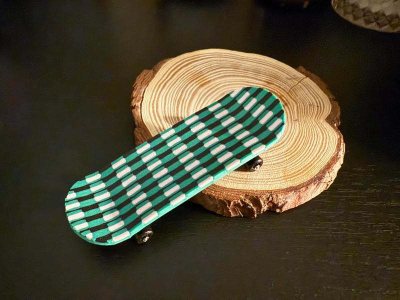 Green checkered skateboard deck