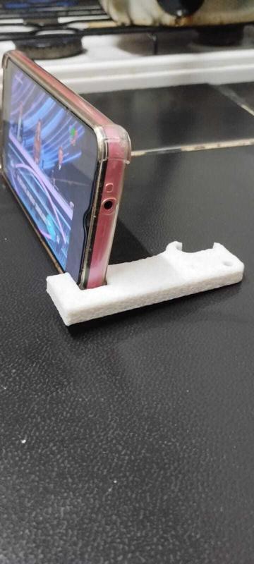 Key ring cell phone holder and bottle opener