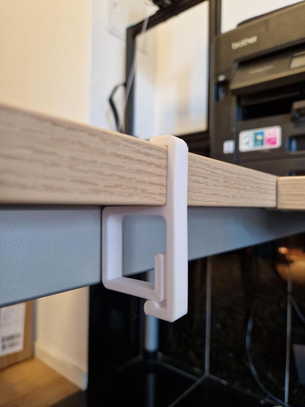 Cable holder for office desks with 25mm desk top thickness