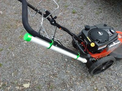 Walk behind trimmer line storage tube