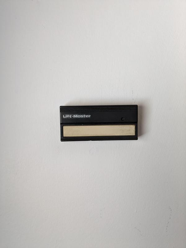 Garage door remote wall mount