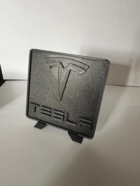 Tesla logo plate
