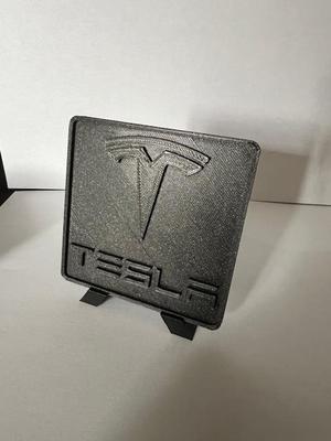 Tesla logo plate