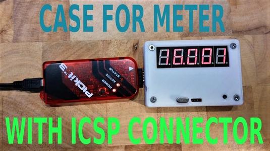 Case for frequency meter with programming connector.