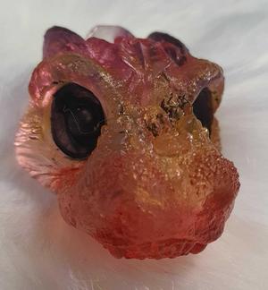 feathered dragon, velociraptor, dromaeosaurid theropod dinosaur jewellery, pendant, necklace, ear ring