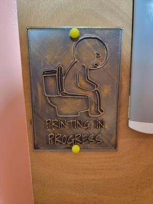 Printing in progress bathroom sign