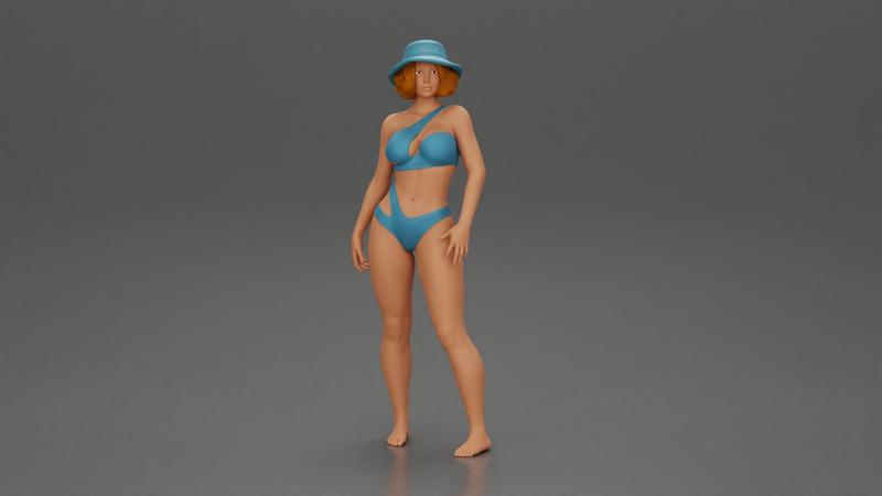 Stylish woman modeling modern asymmetric bikini and hat
