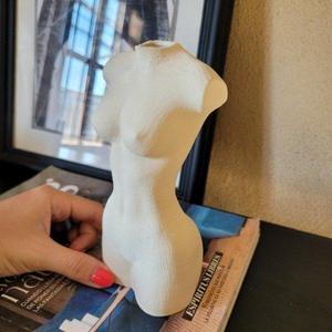 Sculpture of woman vase