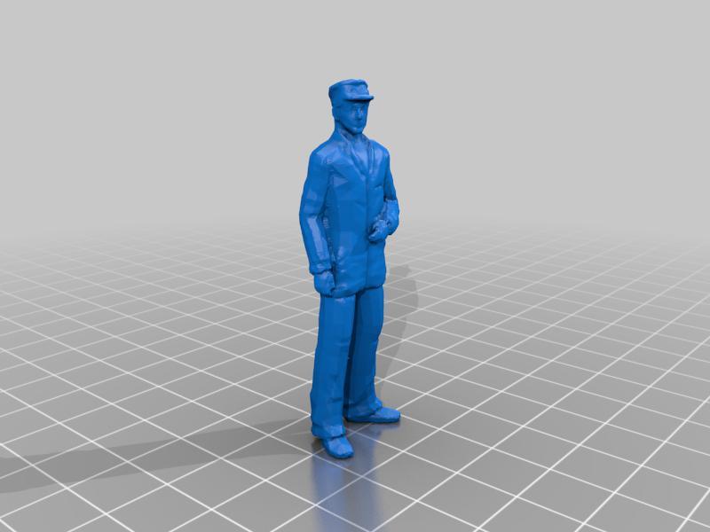 Man with long jacket and cap