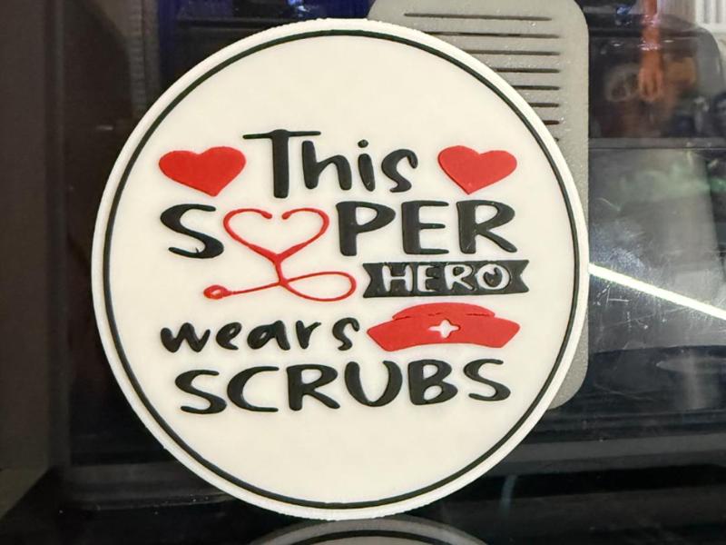 THIS SUPERHERO WEARS SCRUBS 