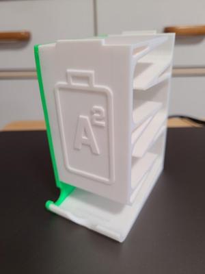 Battery dispenser (ramped) with wall mount holes