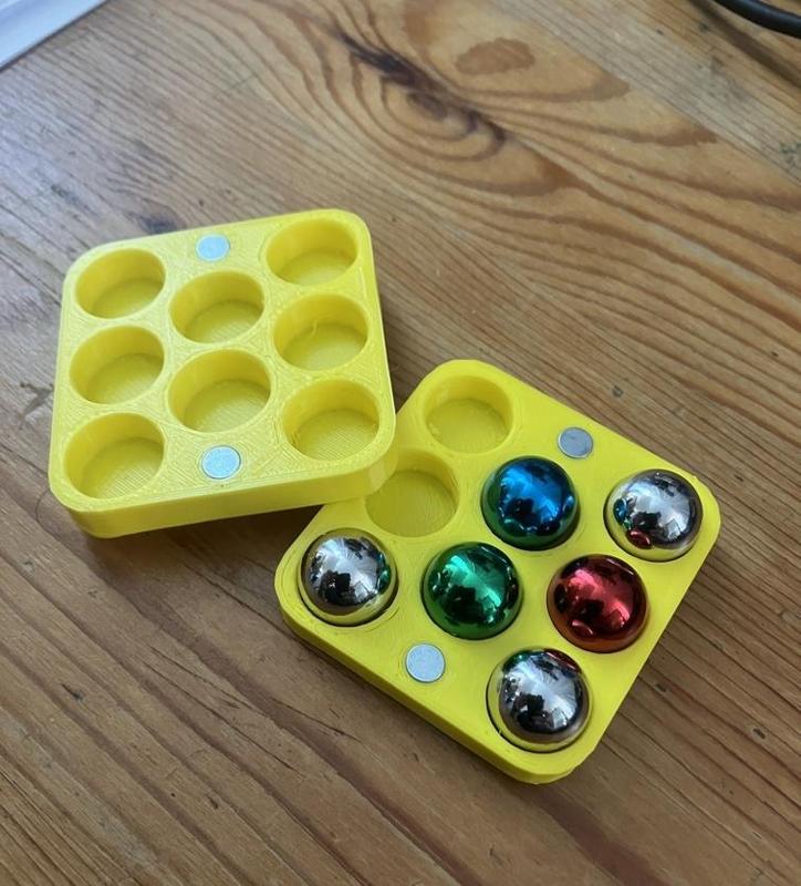 Gravitax compatible balls storage
