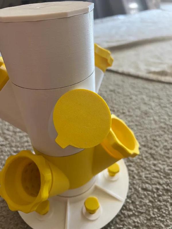 Port cover with a slight bit of tensioning applied and a removal tab   