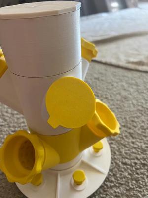 Port cover with a slight bit of tensioning applied and a removal tab   