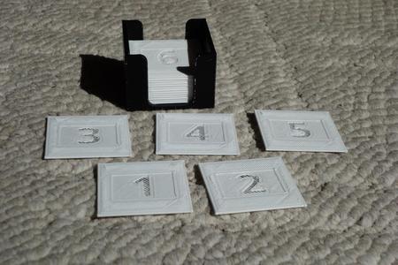 Dummy slides for separating rolls of film in a carousel