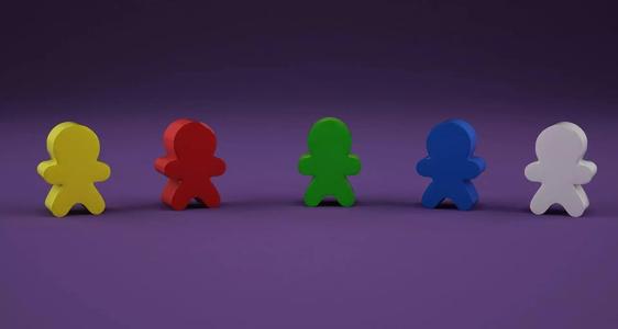Low-poly meeple group of different colored wooden figures