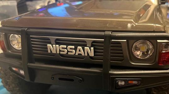 Yikong 4107 front NISSAN badge