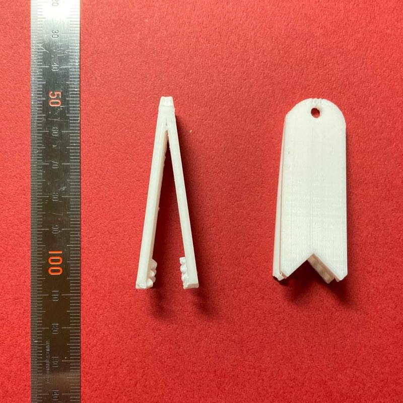 A small pair of tongs.