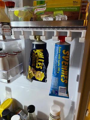 Tube holder for fridge   