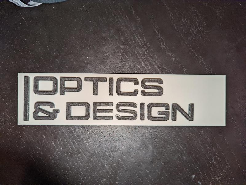 Optics & Design Sign - Severence AppleTV