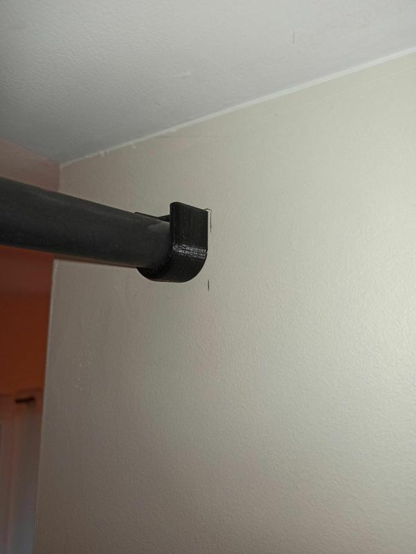 Wardrobe curtain rod support