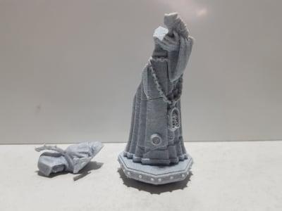 Broken Hooded statue