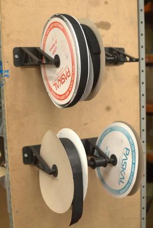 Modular wall mounted webbing and binding rack   