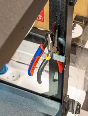 Enclosure corner tool holder