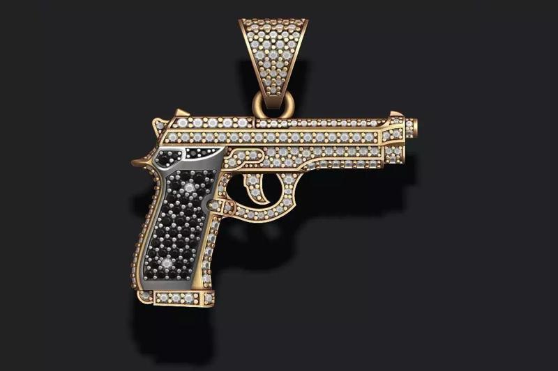 Gun pendant with diamonds