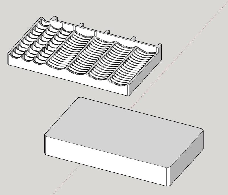 Enlarged button battery tray