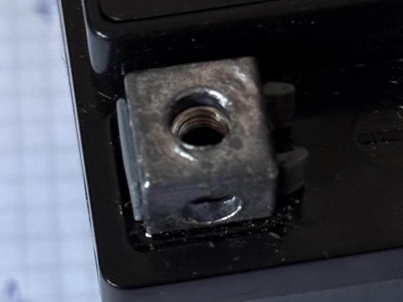 Battery nut holder