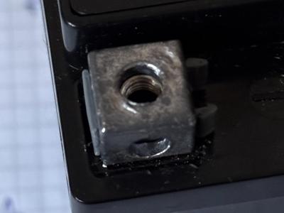 Battery nut holder