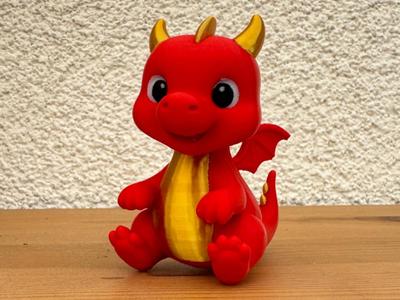 Adorable little baby dragon sitting