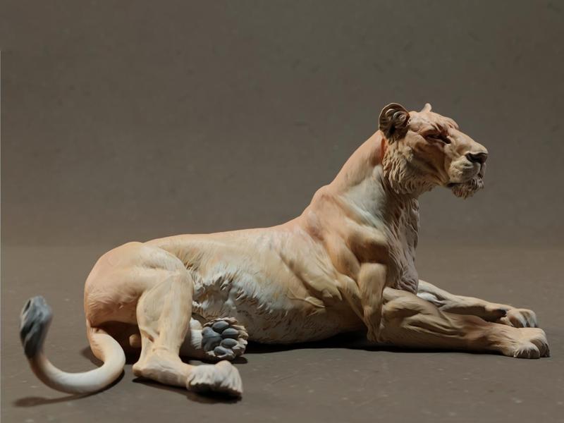 Reclining lion figurine