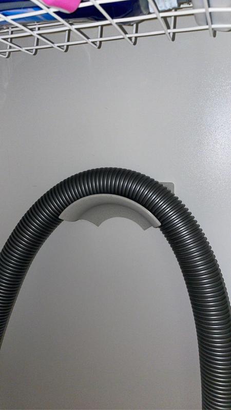 Vacuum hose hanger, no supports.