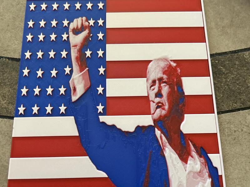 Trump fist pump with flag