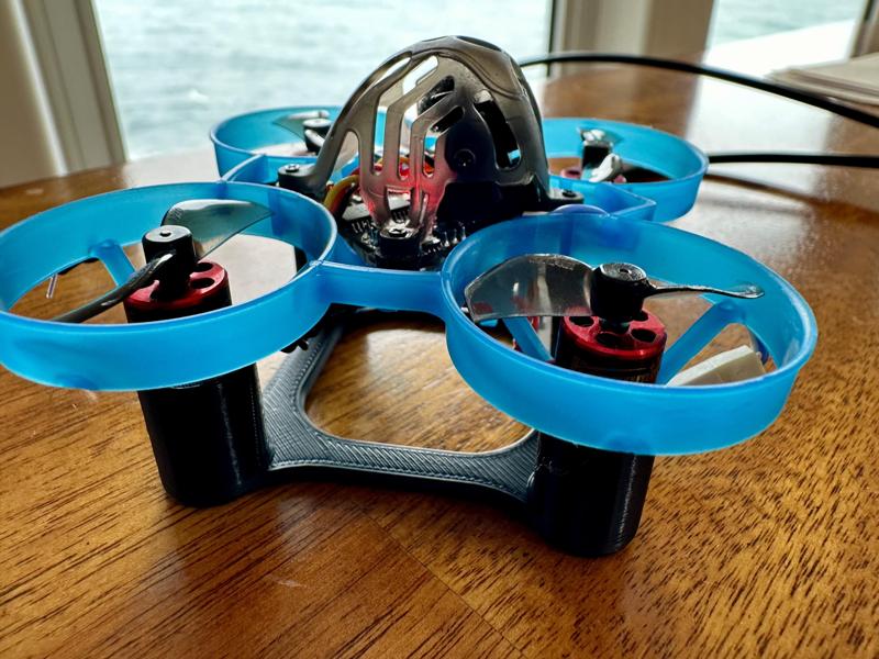 Tiny Whoop 65mm Levelling calibration stand with room to leave the usb plugged in on the table.