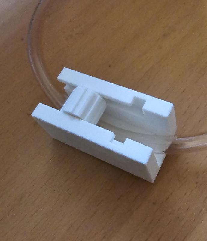 Customizable pinch valve for flexible tubing