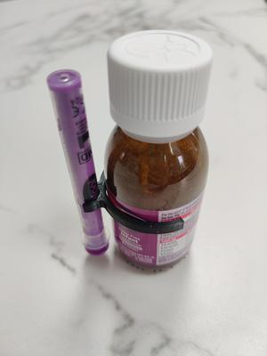 Calpol bottle and syringe clip