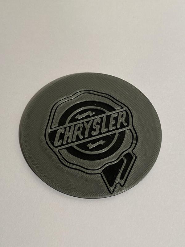 Chrysler badge for wheel chock