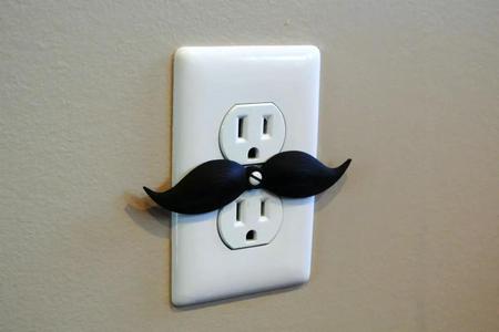 Mustache shaped outlet cover