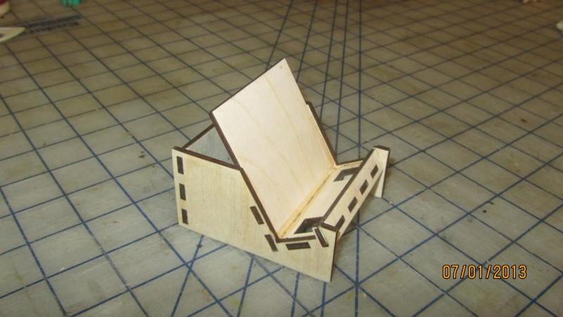 Universal phone and small tablet stand.  Lasered