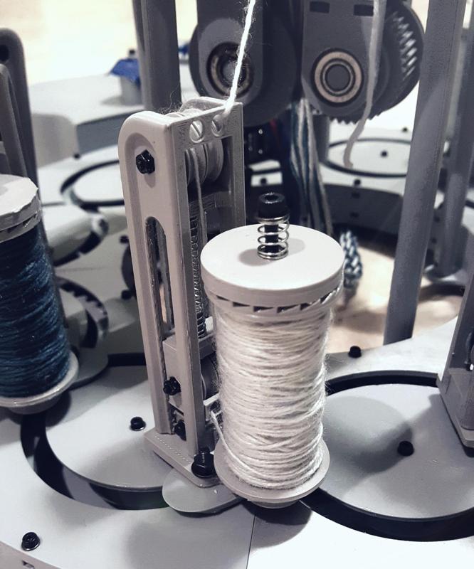 Miniature Bobbin Constant Tensioning Mechanism