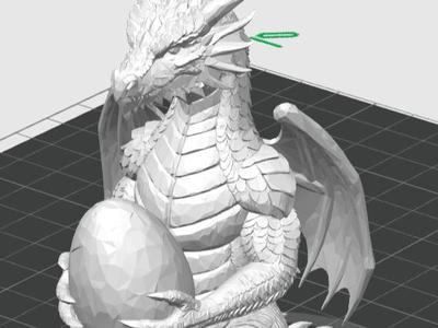 dragon figure holding an egg